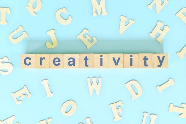 istock Creativity business skill concept. Word typography on wooden blocks flat lay. 1439148003