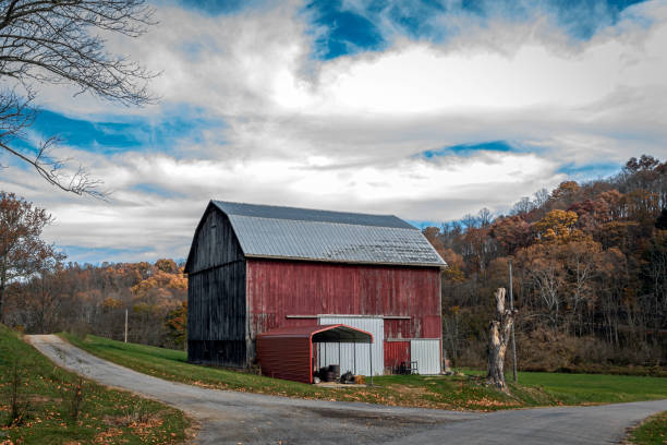 istock Old red barn at rural crossroads 1439152279