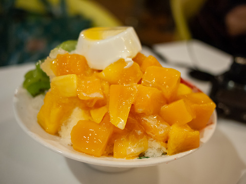 a bowl of mango shaved ice