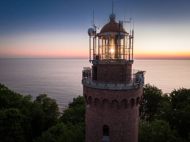 istock Glowing lighthouse on Baltic sea at sunset in Poland. 1439155497