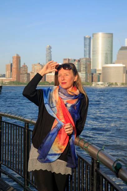 Pretty active women wears a headscarf enjoying in Panorama of New York City skyline Lower Manhattan Pretty active women wears a headscarf enjoying in Panorama of New York City skyline Lower Manhattan and the Freedom Tower new york marathon photos stock pictures, royalty-free photos & images