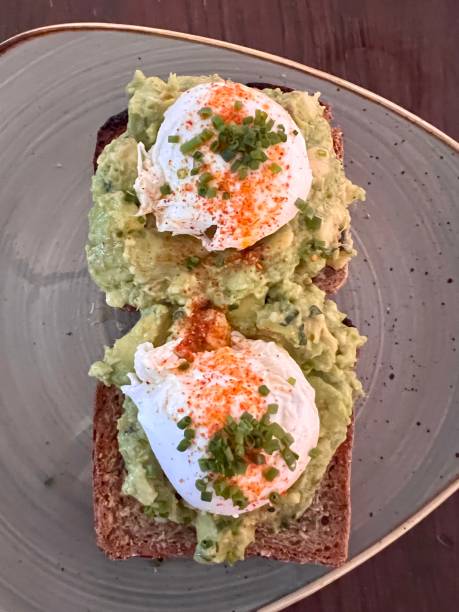 istock Poached eggs and avocado on Nordic bread 1439160704