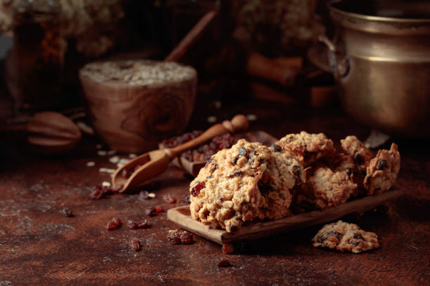 istock Oatmeal raisin cookies on a brown table. 1439162095