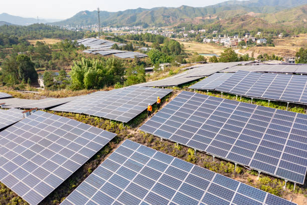 istock Two workers patrol the solar power plant 1439163074