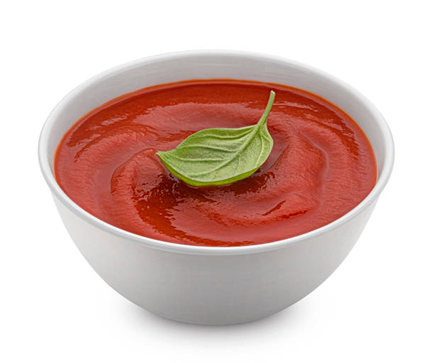 istock Bowl of tomato paste isolated on white background 1439169069