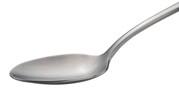 istock Metal spoon isolated on white background, full depth of field 1439169892