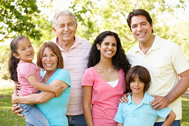 istock Multi Generation Hispanic Family Walking In Park 143917060