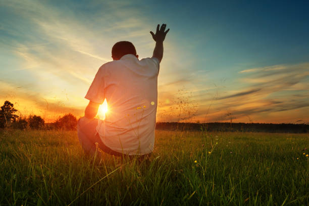 man prays を神 - praying men god kneeling ストックフォトと画像