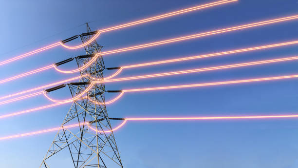 istock Electricity transmission towers with glowing wires 1439170878