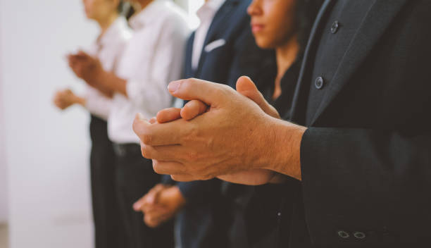 istock Happy business employees professional officer team clapping hands with praise to support ideas planing sitting in meeting room cooperating together in creative negotiations concept 1439171668