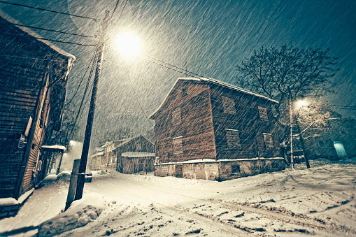 wooden houses, heavy snowfall, winter in town.