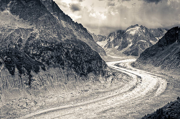 The Mer de Glace (sea of ice) is the second largest glacier in the Alps (the largest being the Aletsch Glacier, Switzerland). It is estimated to contain approx 4000 million cubic metres of frozen water; is 12k long and varies in width from 700 - 1950m. The photo is made with the technique of the HDR, by merging different photos at different exposure time to retain details in the highlights and shadows. Then it was converted to black and white and toned differently for highlights and shadows.