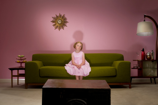 young girl left in front of the tv , 