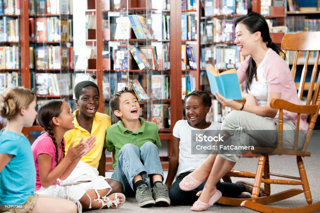 Elementary students Elementary students in a library classroom Adult Stock Photo