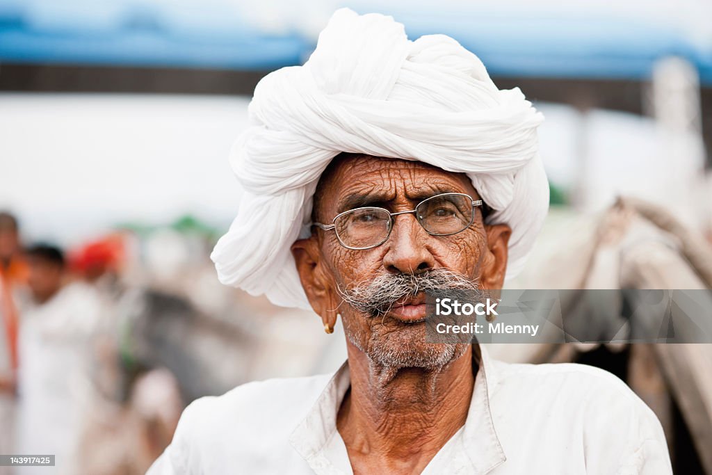 Comerciante en feria de camellos de Pushkar India personas reales de Retratos - Foto de stock de Cultura hindú libre de derechos