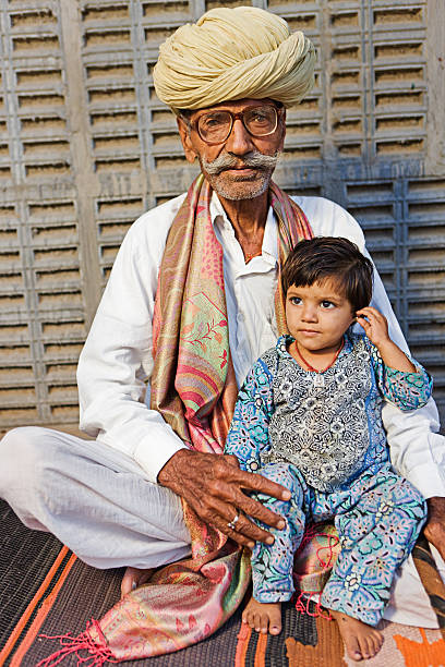 istock Indian old man with his granddaughter. Rajasthan 143917444