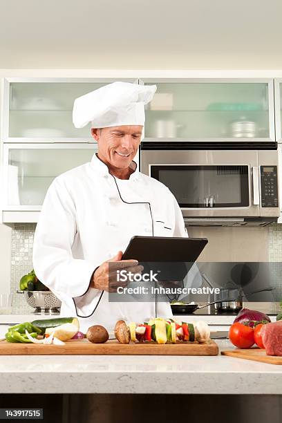Master Chef Making Notes On Dinner Stock Photo - Download Image Now - 50-54 Years, Adult, Bell Pepper