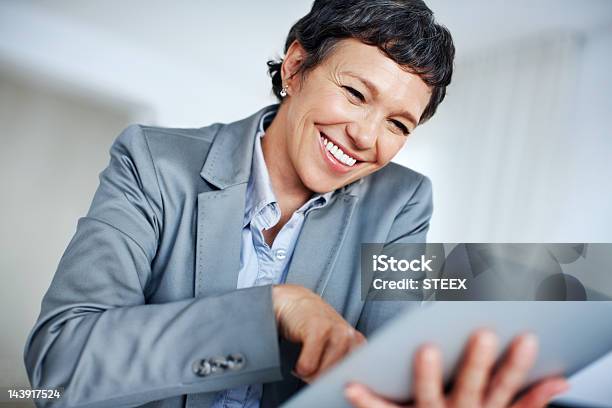 Happy Business Woman Using Digital Tablet Stock Photo - Download Image Now - 50-59 Years, Adult, Adults Only