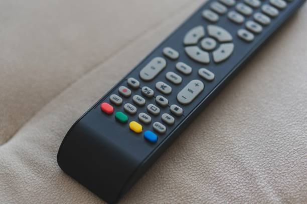 istock High angle shot of a remote control on a cream sofa 1439176169