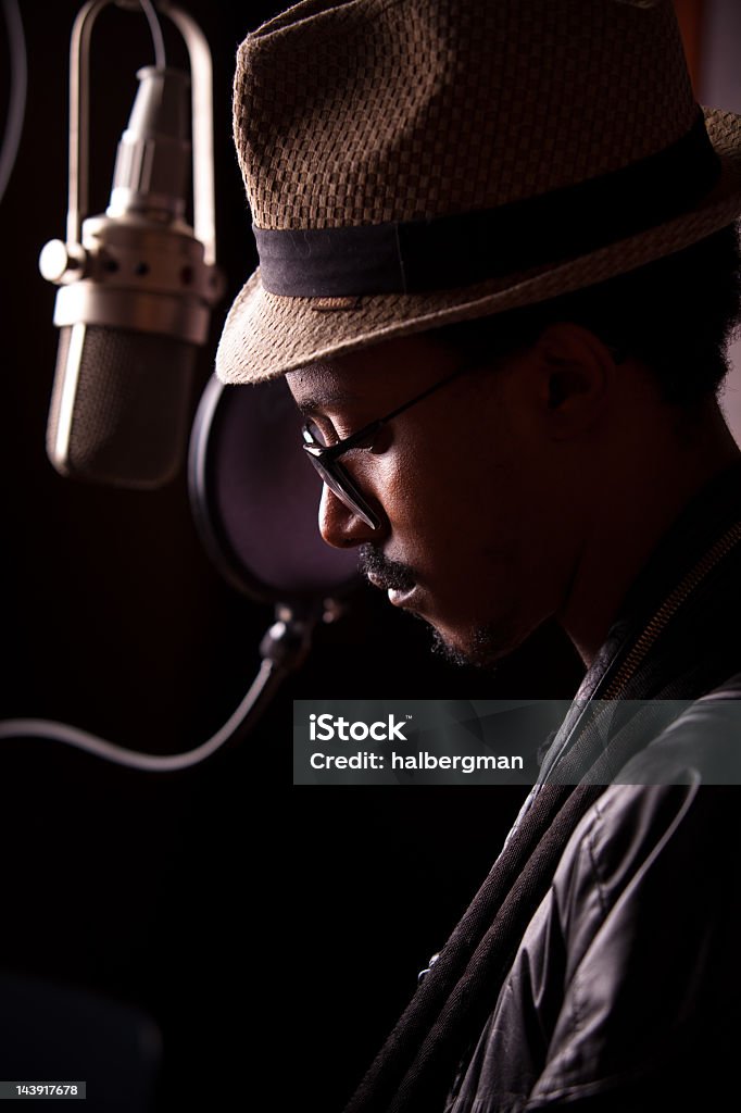 Portrait of an Introspective Recording Artist African-American recording artist recording an album in the studio


[url=http://www.istockphoto.com/search/lightbox/3851526][img]http://www.halbergman.com/istock/collections/recordingstudio.jpg[/img][/url] Rap Stock Photo