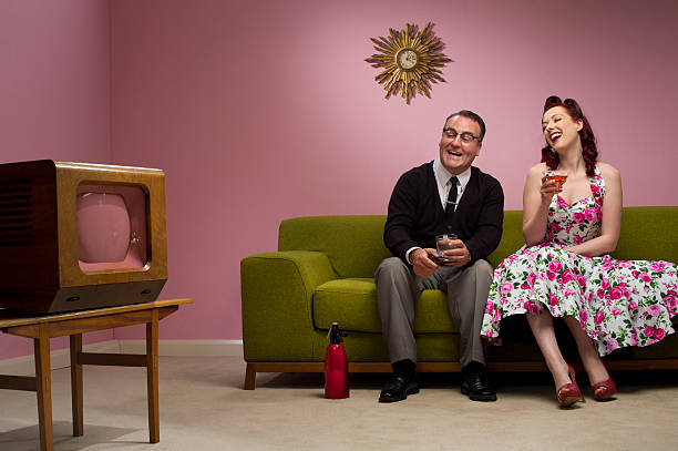 tv fun retro couple laugh at their tv set pin up girl photos stock pictures, royalty-free photos & images