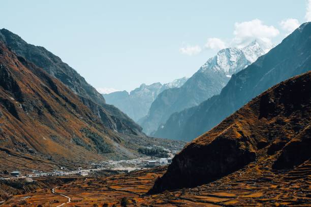 istock Beautiful deserted valley with snowy mountains in the background 1439178900