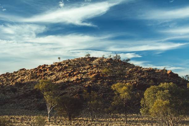 istock Beautiful view of a green mountain under blue cloudy sky 1439179274