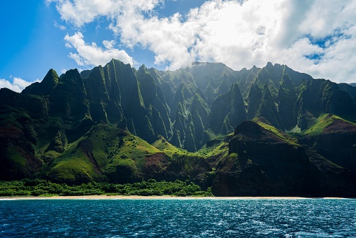 A beautiful scenery of rocky cliffs on Napali Coast, Kauai, Hawaii on a sunny day