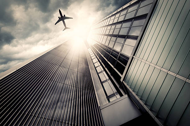 istock Business towers with an airplane silhouette 143917956