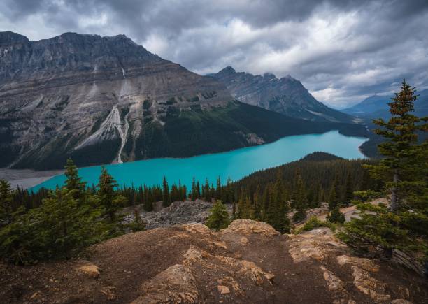 istock Distant view of a lake surrounded by mountain ranges in Canada 1439179699