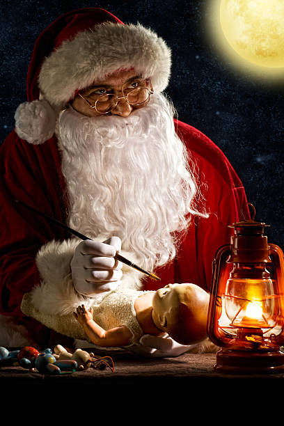 istock Santa Claus painting a toy 143918062
