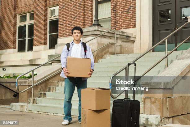 Asian Young Man Student Moving Into University Campus Dormitory Entrance Stock Photo - Download Image Now