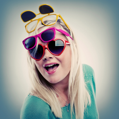Happy woman  in many sunglasses