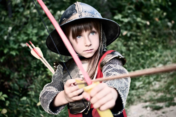 리틀 archer in woods - little girls period costume playing child 뉴스 사진 이미지