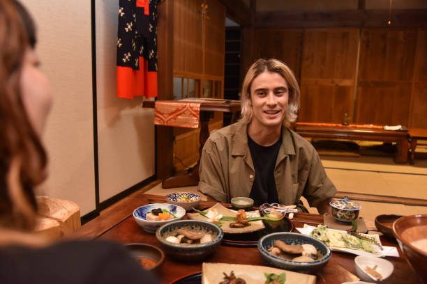 istock Japanese tourist having a dinner and having conversation - stock image 1439183288