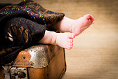 istock Baby left on a suitcase covered with a blanket - divorce, single parent concept 1439183365