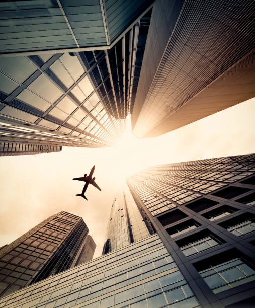 istock Business towers with a airplane silhouette 143918340