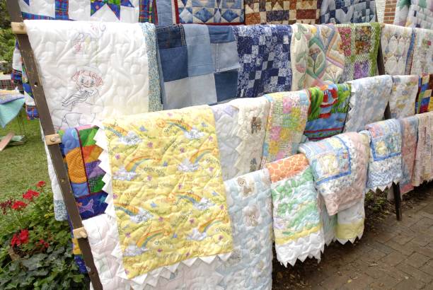St. Charles, United States – September 12, 2008: A display of hand-made quilts at an outdoor quilt show in St. Charles, Missouri.