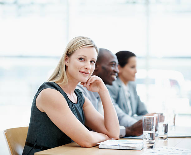 istock Beautiful executive with business people during meeting 143918441