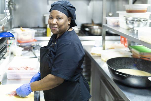 Closeup shot of a female hospital cook cooking for hospitalized patients A closeup shot of a female hospital cook cooking for hospitalized patients food service occupation stock pictures, royalty-free photos & images