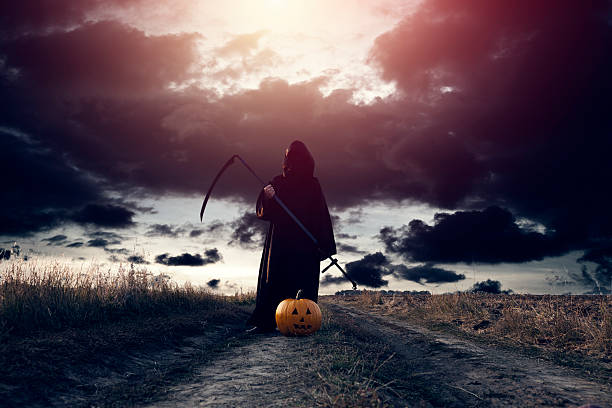 Grim Reaper and Jack O' Lantern stock photo