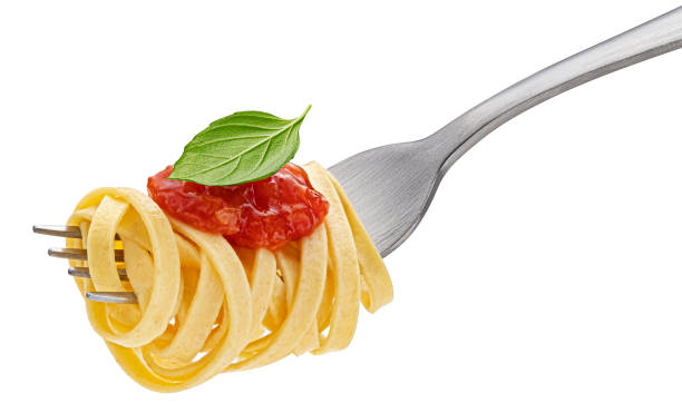 istock Italian spaghetti on fork isolated on white background 1439191799
