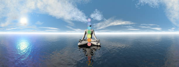 istock Man meditating upon the ocean and chakra colors - 3D render 1439192611