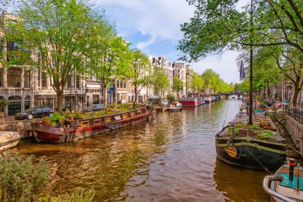 istock Typical buildings and canal in Amsterdam, Netherlands 1439193518