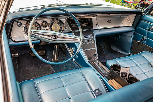 Des Moines, IA - July 01, 2022: HIgh perspective detail interior view of a 1964 Buick Riviera 2 Door Hardtop at a local car show.
