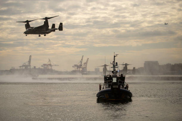 Manhattan New York 31 October 2022. President Biden went to New York to attend the Met memorial for Antony Blinken's late dad. The shot is the armed water protection, and the first of two Osprey helicopter can be seen leaving the dock.  A third can be circling far off in the distance.