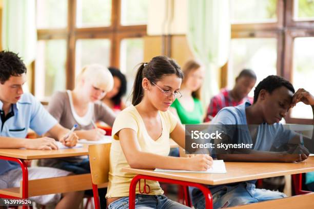 Students Writing In Their Notebooks Stock Photo - Download Image Now - Adolescence, Adult Student, African Ethnicity