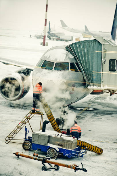 Airplane de-iced after snowstorm