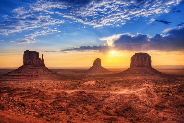 Magnificent landscape view of Monument Valley at sunset West Mitten Butte, East Mitten Butte and Merrick Butte in Monument Valley, USA. monument valley tribal park photos stock pictures, royalty-free photos & images