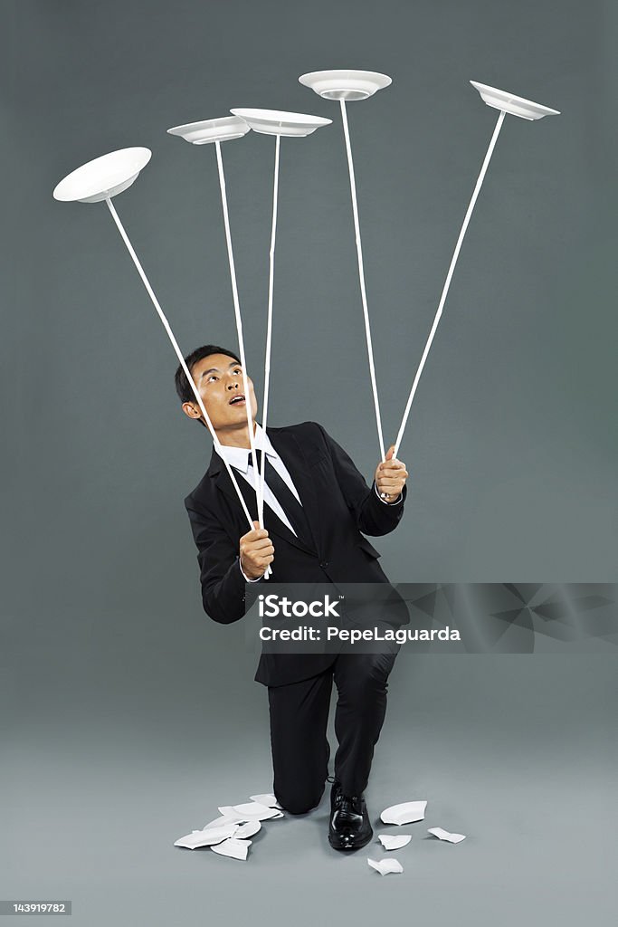 Young chinese man spinning dishes - Royalty-free Bord - Serviesgoed Stockfoto